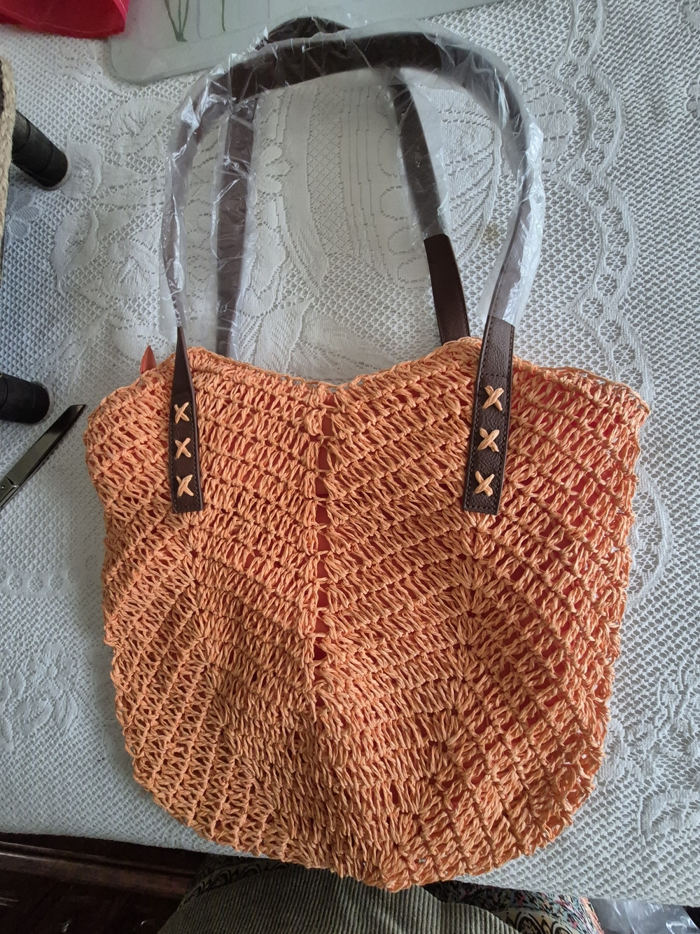 New Woven Orange Shoulder Bag with Brown Handles.